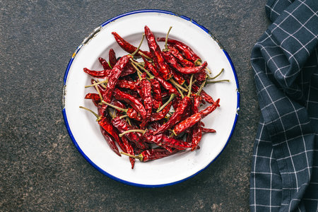 Red chili peppers in the bowl. Top view.の写真素材