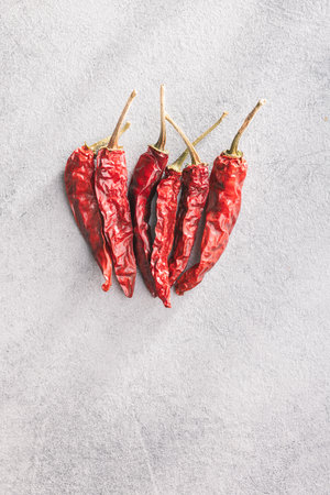 Red chili peppers on the kitchen table. Top view.の写真素材