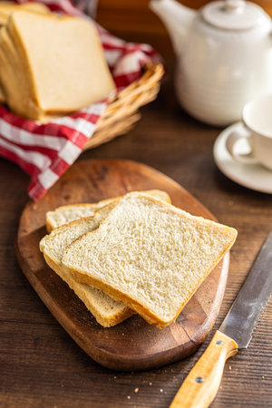 White sliced toast bread on the wooden table.の写真素材