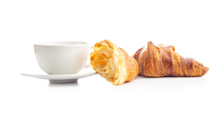 Fresh butter croissant and coffee cup isolated on white background.の写真素材