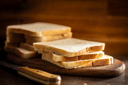 White sliced toast bread on the wooden table.の写真素材