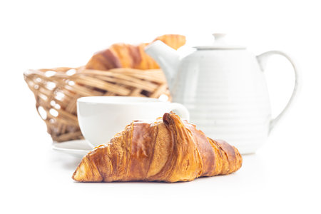 Fresh butter croissant and coffee cup isolated on white background.の写真素材
