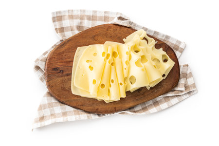 Slices of cheese on cutting board isolated on the white background.の写真素材