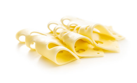 Slices of cheese isolated on the white background.の写真素材
