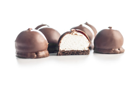 Chocolate covered marshmallows. Sweet dessert isolated on the white background.の写真素材