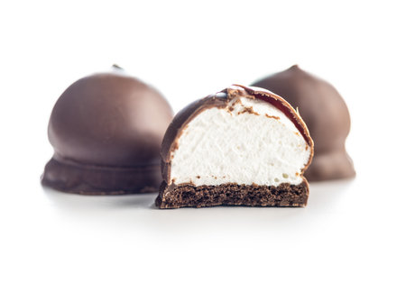 Chocolate covered marshmallows. Sweet dessert isolated on the white background.の写真素材