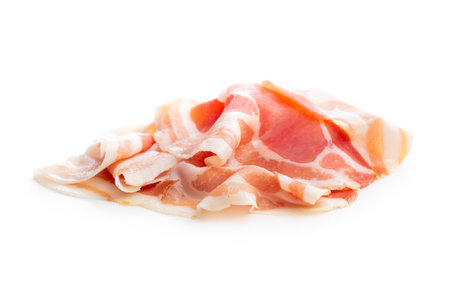 Italian panchetta piancetina. Sliced smoked bacon isolated on the white background.の写真素材
