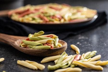 Fusilli Pugliese. Italian twisted pasta on the wooden spoon.の写真素材