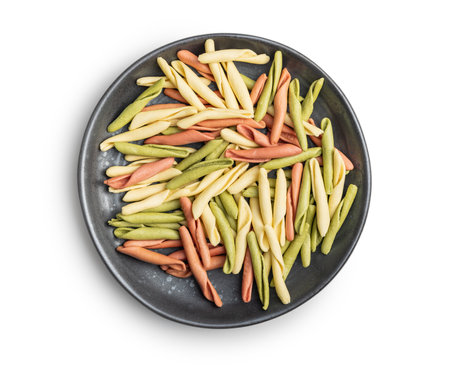 Fusilli Pugliese. Italian tricolor twisted pasta isolated on the white background.の写真素材