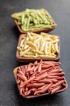Fusilli Pugliese. Italian tricolor twisted pasta in the bowl.の写真素材