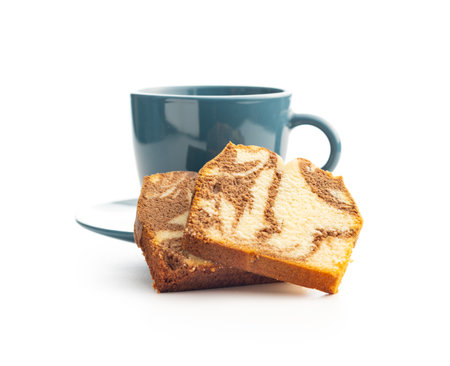 Marble sponge cake and coffee cup. Cake with cocoa and vanilla taste isolated on the white background.の写真素材