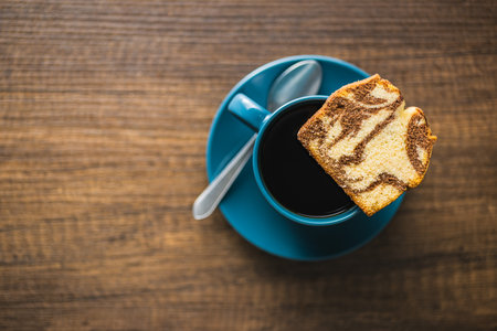 Marble sponge cake and coffee cup. The cake with cocoa and vanilla taste. Top view.の写真素材