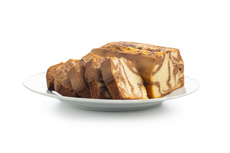 Marble sponge cake. Cake with cocoa and vanilla taste isolated on plate on the white background.の写真素材