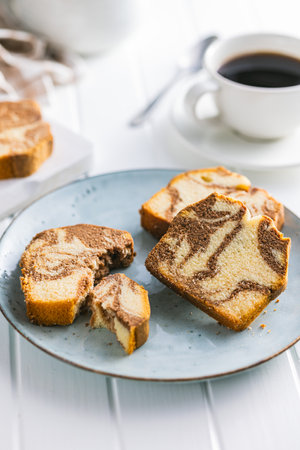 Marble sponge cake. Cake with cocoa and vanilla taste on the plate.の写真素材