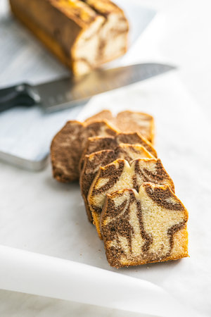 Marble sponge cake. Cake with cocoa and vanilla taste on the kitchen table.の写真素材
