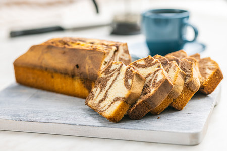 Marble sponge cake. Cake with cocoa and vanilla taste on the cutting board.の写真素材