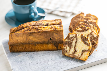 Marble sponge cake. Cake with cocoa and vanilla taste on the cutting board.の写真素材