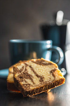 Marble sponge cake and coffee cup. The cake with cocoa and vanilla taste.の写真素材
