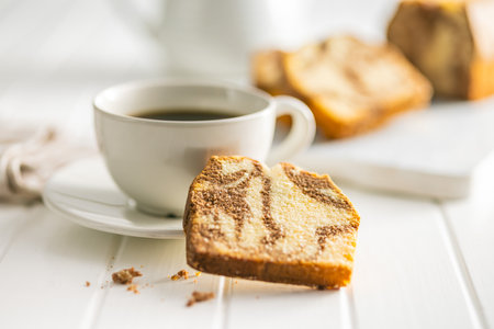 Marble sponge cake and coffee cup. The cake with cocoa and vanilla taste.の写真素材