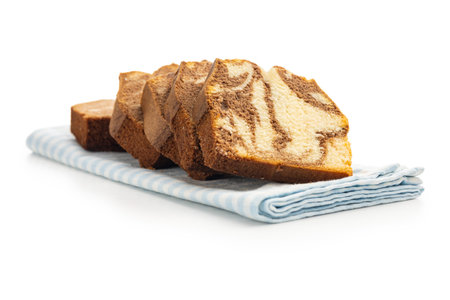 Marble sponge cake. Cake with cocoa and vanilla taste isolated on the white background.の写真素材