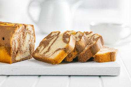 Marble sponge cake. Cake with cocoa and vanilla taste on the cutting board.の写真素材