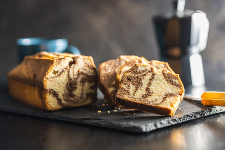 Marble sponge cake. Cake with cocoa and vanilla taste on the cutting board.の写真素材