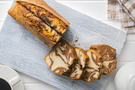 Marble sponge cake. Cake with cocoa and vanilla taste on the cutting board. Top view.の写真素材
