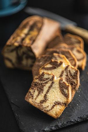 Marble sponge cake. Cake with cocoa and vanilla taste on the cutting board.の写真素材
