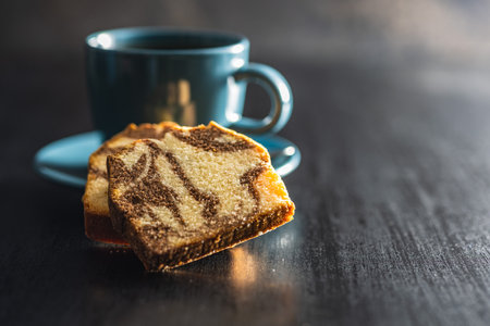 Marble sponge cake and coffee cup. The cake with cocoa and vanilla taste.の写真素材
