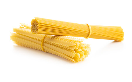 Spaghetti and mafaldine pasta. Uncooked italian pasta isolated on the white background.の写真素材