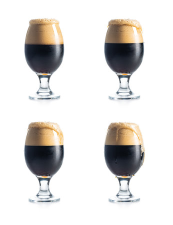 Dark beer with overflowing foam head isolated on a white background. Four variants.の写真素材