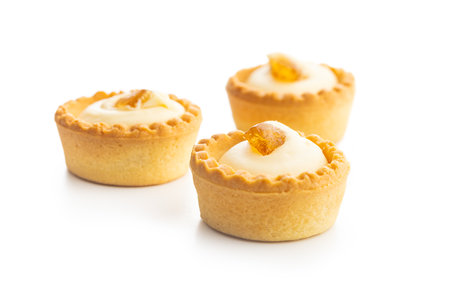 Sweet tartlets. Tasty mini tarts. Mini pie with cream isolated on the white background.の写真素材