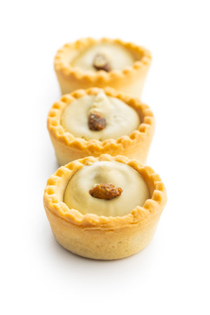 Sweet tartlets. Tasty mini tarts. Mini pie with cream isolated on the white background.の写真素材