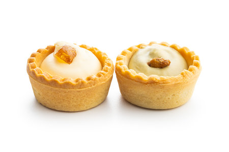 Sweet tartlets. Tasty mini tarts. Mini pie with cream isolated on the white background.の写真素材