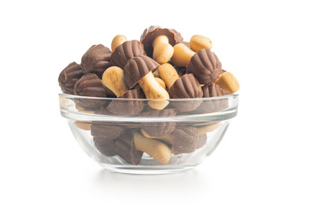 Candy in the shape of a mushroom. Chocolate mushrooms in a bowl isolated on the white background.の写真素材