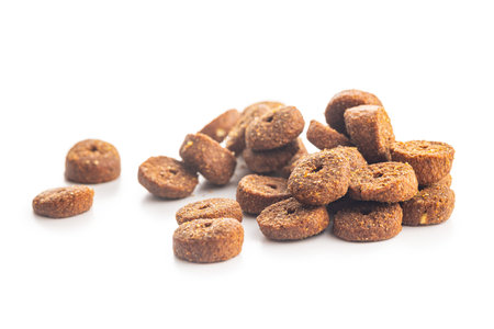 Dry animal food. Dog or cat kibble isolated on the white background.の写真素材