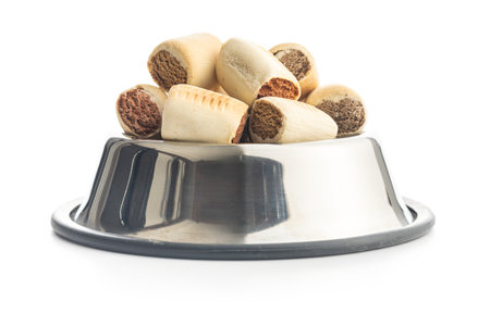 Dry animal food. Dog or cat kibble in bowl isolated on the white background.の写真素材
