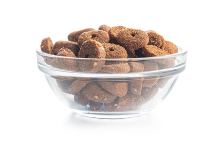 Dry animal food. Dog or cat kibble in bowl isolated on the white background.の写真素材