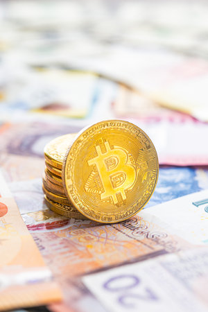 Bitcoin on the various banknotes background.の写真素材