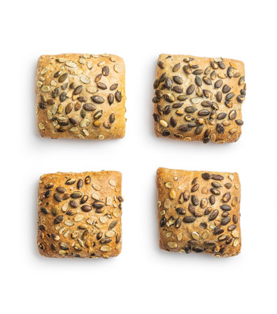 Whole grain bun with pumpkin seeds isolated on the white background.の写真素材