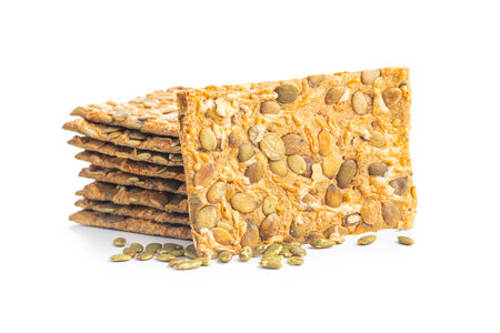 Knackebrot with pumpkin seeds. Wholegrain crispbread isolated on the white background.の写真素材