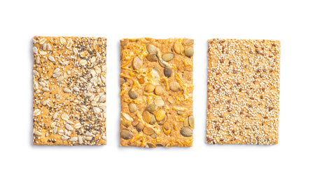 Knackebrot with sesame and pumpkin seeds. Wholegrain crispbread isolated on the white background.の写真素材