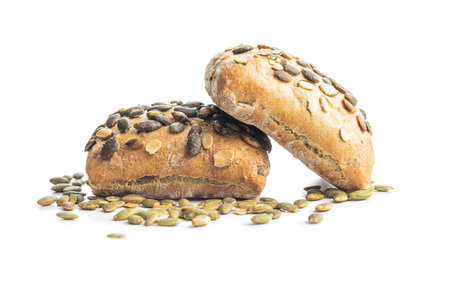 Whole grain bun with pumpkin seeds isolated on the white background.の写真素材