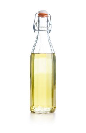 Olive oil or sweet syrup in glass bottle isolated on the white background.の写真素材