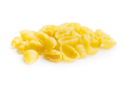 Uncooked gnocchi pasta. Raw italian pasta isolated on the white background.の写真素材