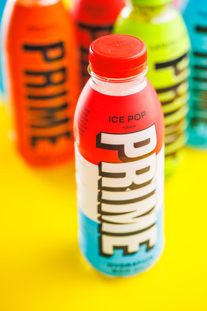 Prime Energy Drink. Bottle drink on the yellow background.のeditorial素材