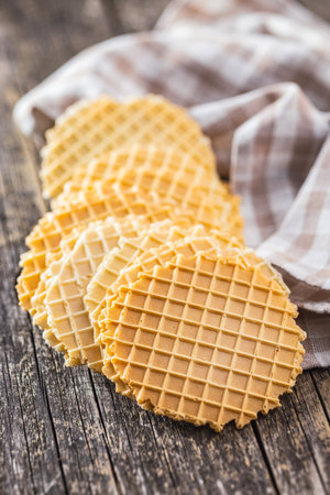 Round waffle biscuits on the wooden table.の写真素材