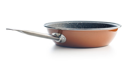 Empty clean frying pan isolated on the white background.の写真素材