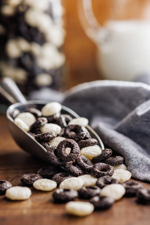 Sweet breakfast cereals in scoop on the kitchen table.の写真素材