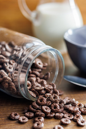 Sweet breakfast cereals in a jar on the kitchen table.の写真素材
